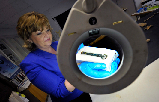 Scotland’s Cabinet Secretary for Culture and External Affairs, Fiona Hyslop with what may be remains of Olaf Guthfrithsson.
